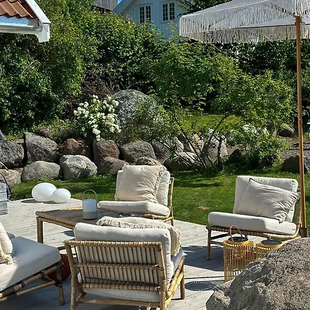With Flower Garden And Veranda On Feriehus Hvasser